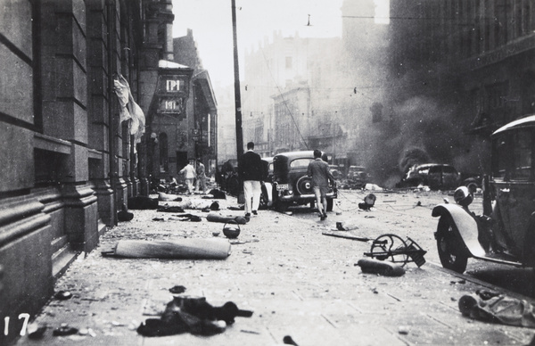 Debris in Nanking Road, after bombing of the Cathay and Palace Hotels, Shanghai, 14 August 1937
