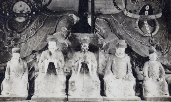 Figures at the feet of Heavenly Kings statues, Longhua Temple, Shanghai (上海)