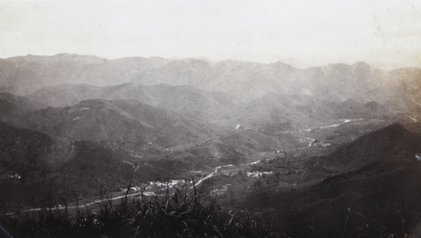 View from mountains of valley road and houses