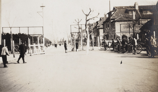 Rickshaw rank at a barricaded road junction patrolled by Japanese marines, Shanghai