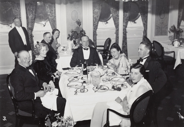 John Montgomery and others a having a meal in a restaurant