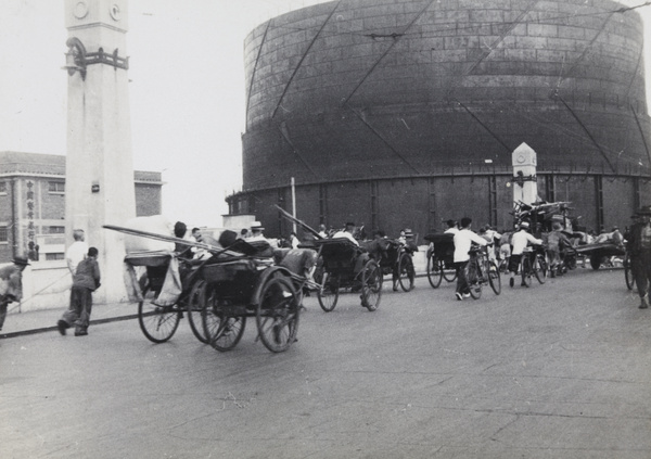 Refugees leaving Zhabei, crossing Thibet Road Bridge beside gas works, Shanghai