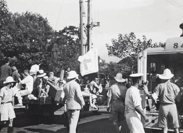 International Red Cross lorry with refugees and a Shanghai Fire Brigade ambulance, Shanghai, 1937