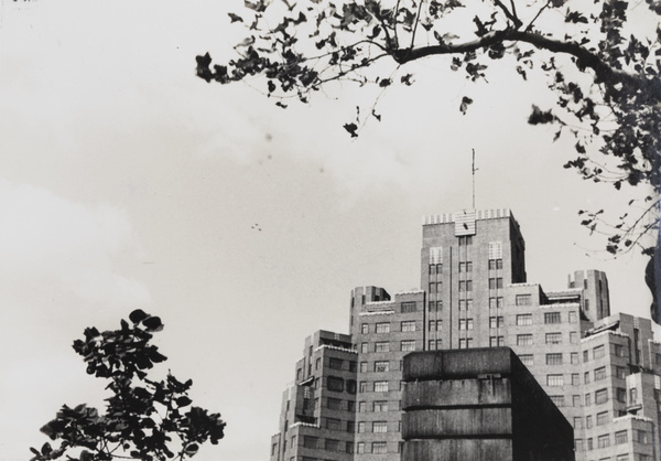 Three Japanese bombers flying above Broadway Mansions, Shanghai, 1937