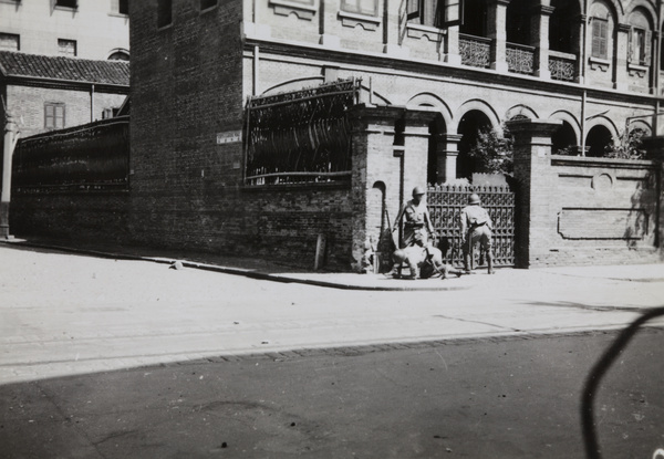 Japanese marines reconnoitering, at the corner of Range Road and North Kiangse Road, Shanghai, August 1937