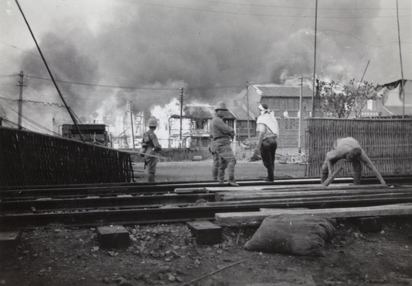 Japanese marines laying a level crossing, near Shanghai North Railway Station, Zhabei, October 1937