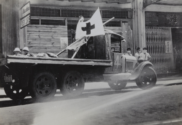 Volunteers in aftermath of bombing of Sincere Company and Wing On department stores, Shanghai, 23 August 1937