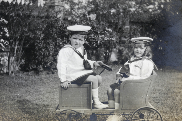 Gerald Johns and Barbara Symons, dressed in sailor suits (HMS Suffolk)