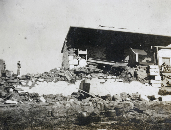 Damaged building near lighthouse