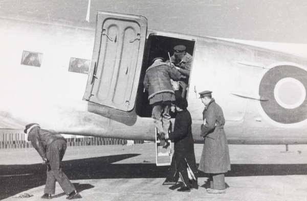 Sir Adrian Carton de Wiart boarding Dakota, Peking