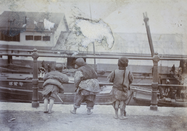 Children looking at barges