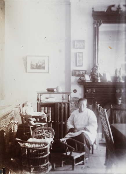 An amah, with two of George Dudeney's chairs and his pram, Shanghai