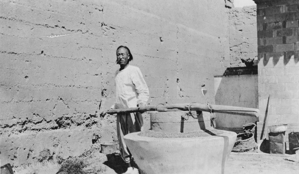 Man milling grain