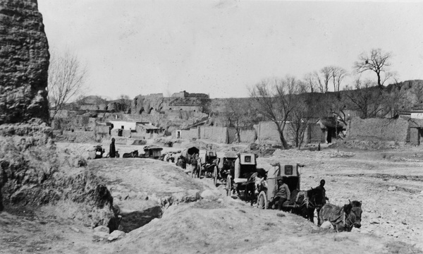 Peking carts on a road near yaodong dwellings