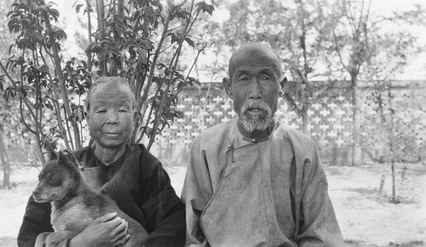 Portrait of an elderly couple, with a dog