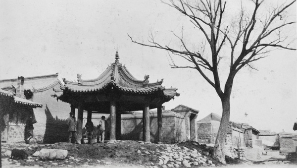 A small pavilion by a tree