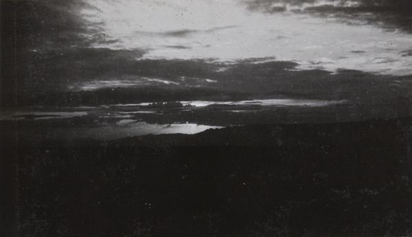 Dramatic clouds at sunset, distant mountains