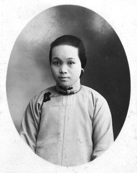 Studio portrait of a woman with an earring