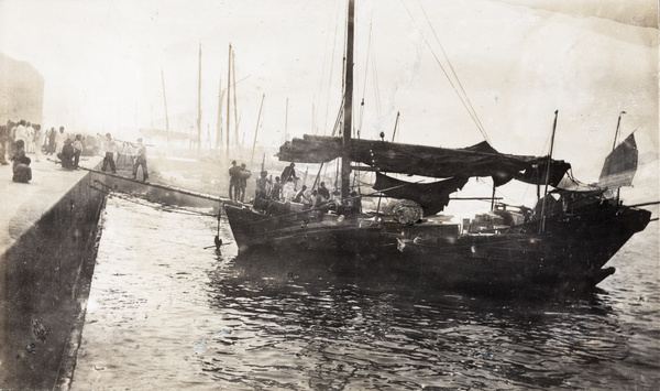 Workers unloading cargo from a boat, Hong Kong