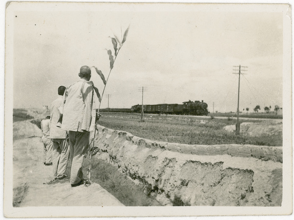Eighth Route Army scouts watching a train - perhaps reconnaissance prior to an attack, Central Hebei (冀中)