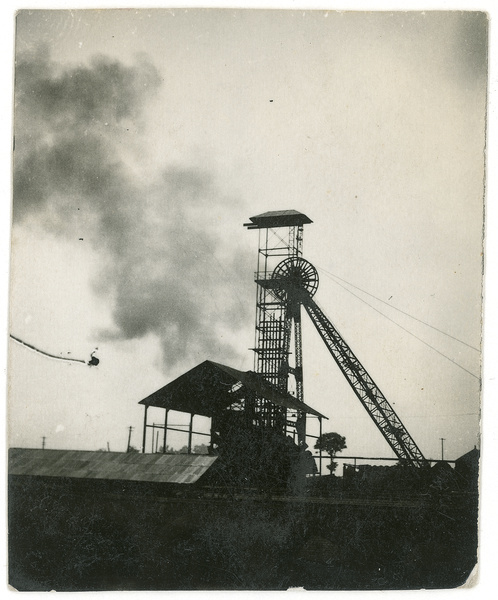 Smoke rising near a winding tower, after bombing at Jingxing coal mine, Hebei