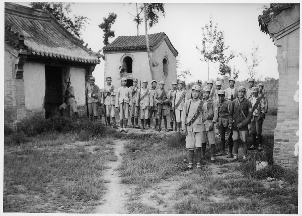 Michael Lindsay's escort of soldiers pose for a photograph