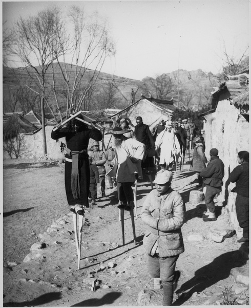 Stilt dance celebrating Chinese New Year, in a village