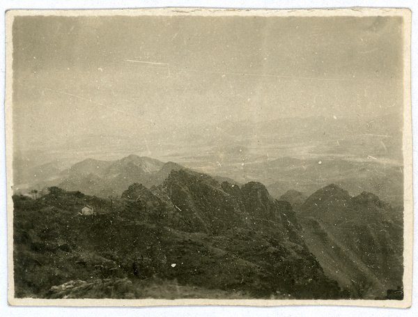 Landscape picture of mountains with a small hut