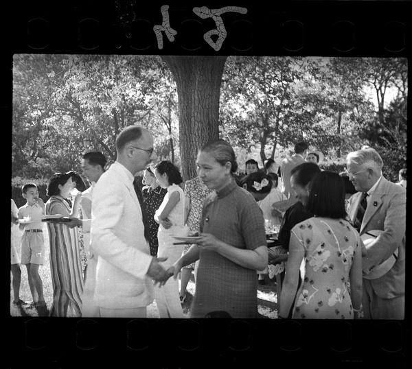 Michael Lindsay (李效黎) greeting a guest at the Lindsays' wedding party at Yenching University (燕京大學), Beijing (北京)