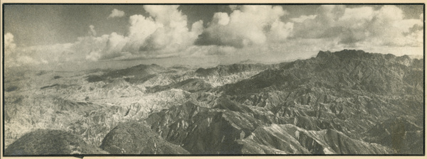 Dramatic aerial view of mountains and clouds