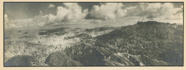 Dramatic aerial view of mountains and clouds