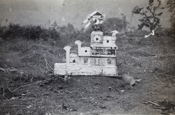 Paper building on a grave