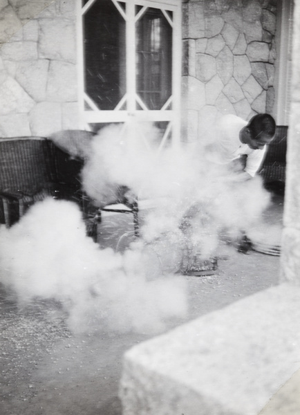 Making popcorn on the verandah of a holiday bungalow, Beidaihe