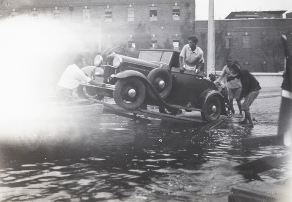 Rescuing a car from flood waters, Tianjin, September 1938