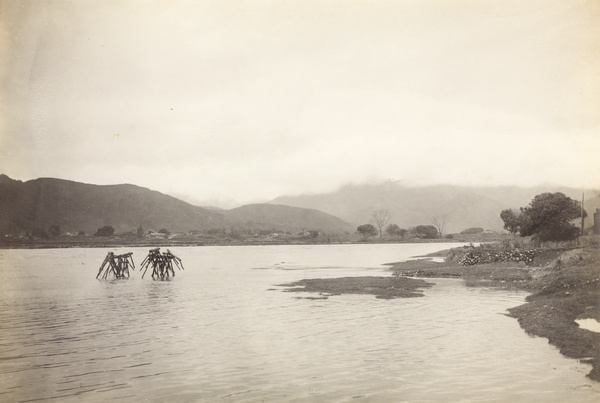 Trestles of a wooden footbridge in flooded river (Dong Xi), Yongchun, Fujian Province