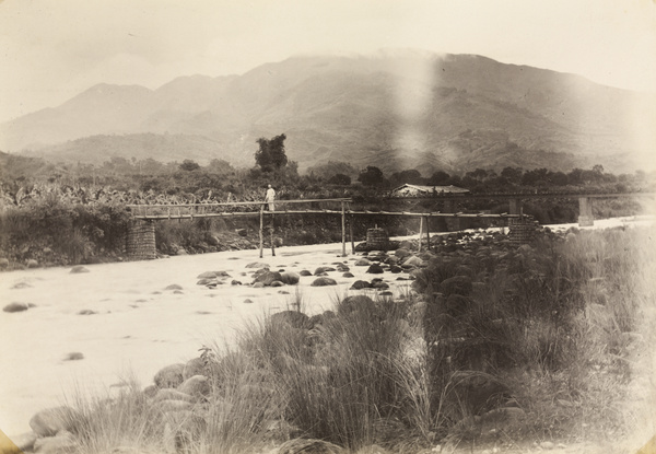 A wooden footbridge and a railway bridge, by a banana plantation, southern Taiwan