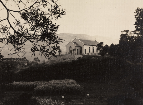 A chapel or church by a field