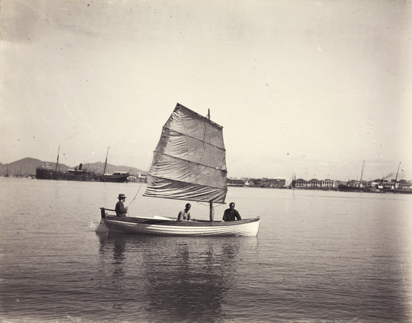 Dr John Otte in his boat, with two Chinese men, Xiamen