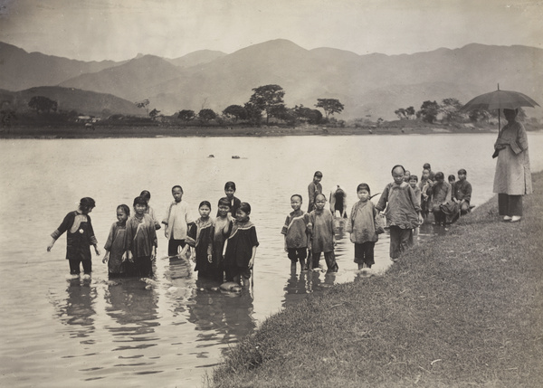 Girls' school pupils washing clothes in the river, Yongchun