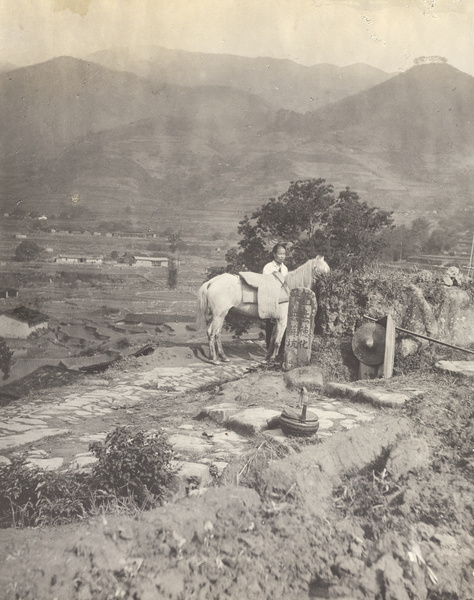 Junction of two pathways, with a man, a horse, and an inscribed roadside stone tablet, Fujian province