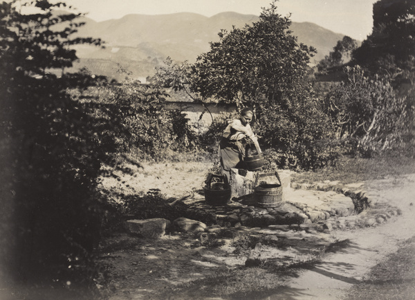 A woman drawing water from a well, Fujian province