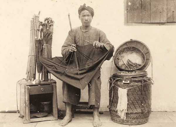 An itinerant umbrella mender with tools and travelling kit