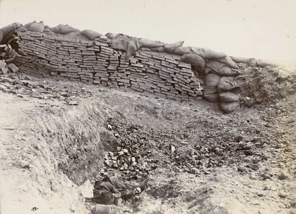 Chinese barricade, dead soldier and empty cartridge clips, Tientsin