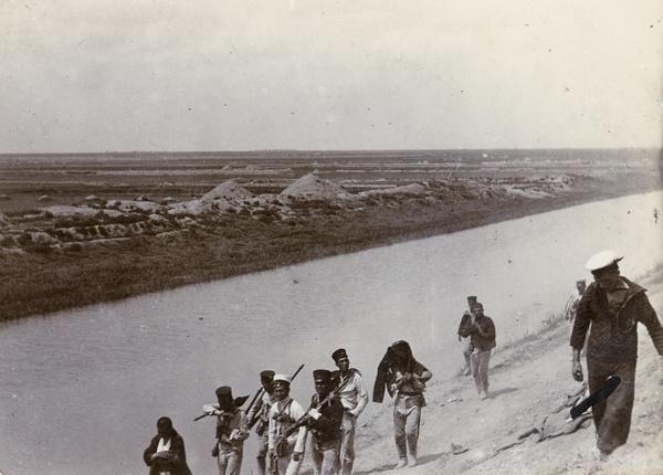 Wounded Japanese soldiers returning from the fight at the Chinese City,Tientsin