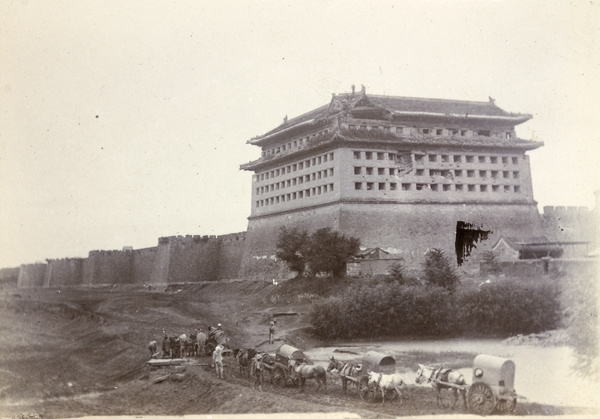 Peking carts and Dongbianmen Tower, Peking