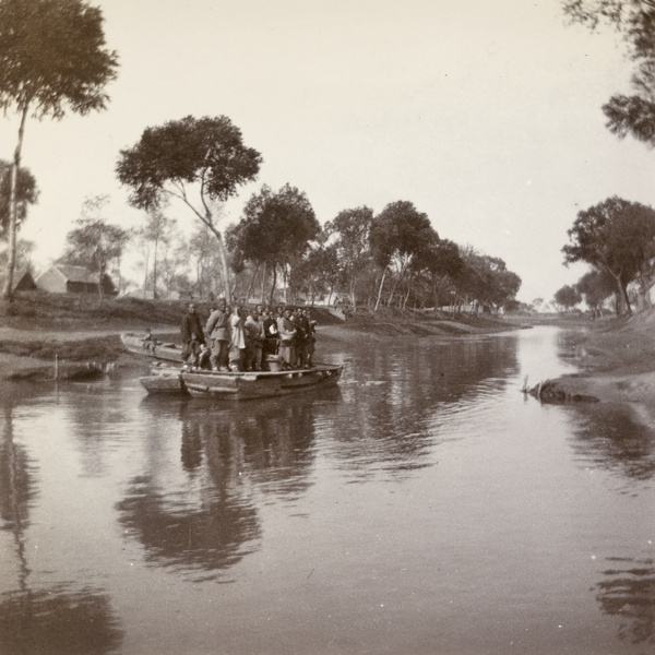 Passengers on a boat on the Hsiao-Ching-Ho