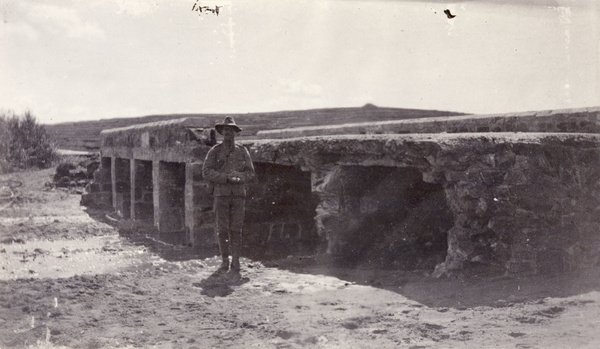 Soldier in front of flood damaged bridge, Weihaiwei