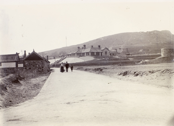 Family walking on a newly constructed road, Weihaiwei