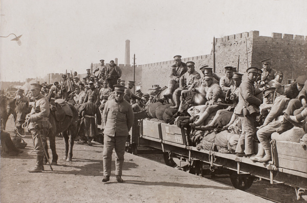 Qing troops on open carriages at railway station, Peking