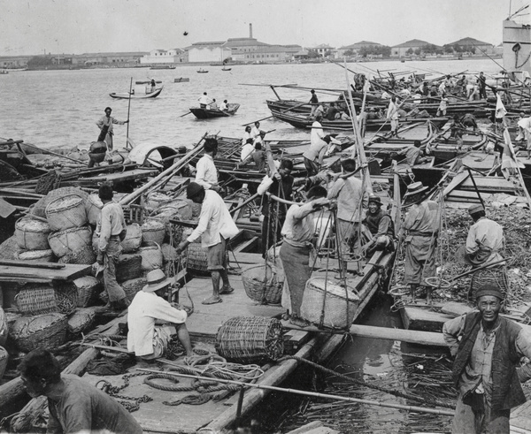 Unloading goods beside a river